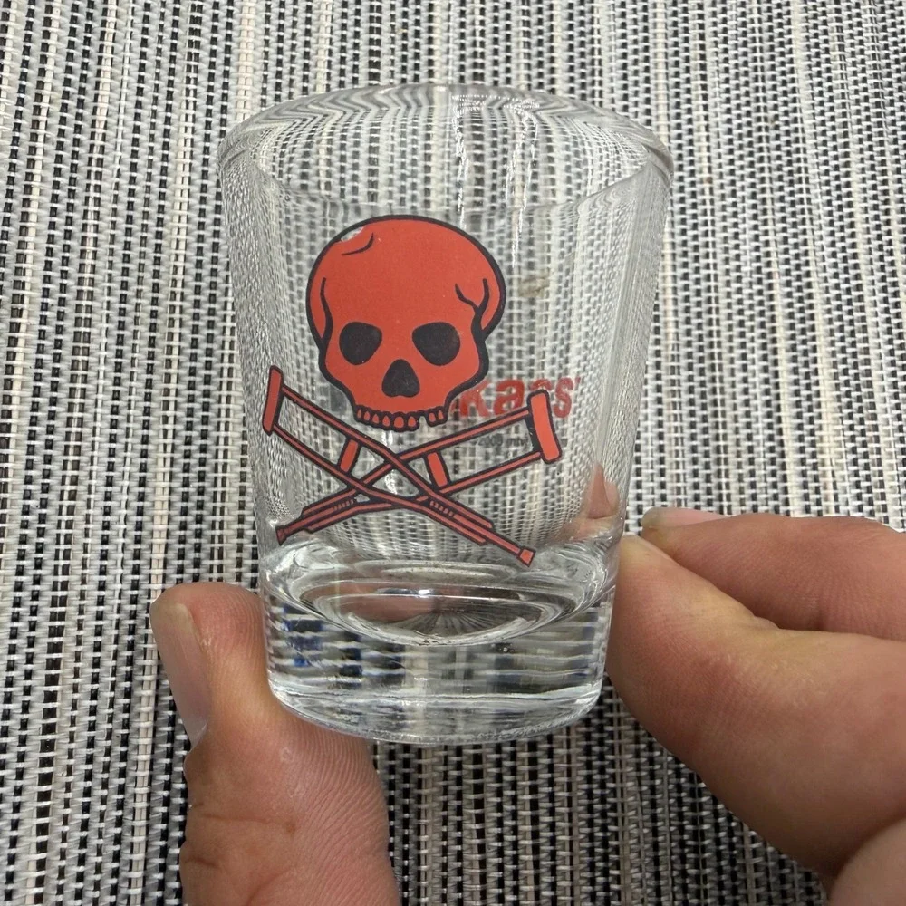 Vintage 2003 MTV Jackass Shot Glass Red Skull Cross Crutches Logo Clear Barware